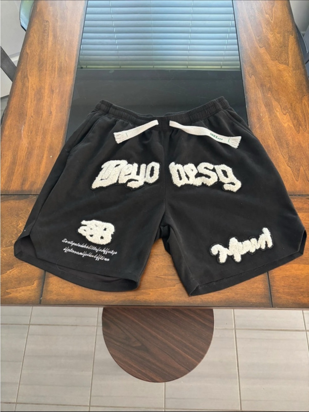 Black Athletic Shorts with White Textured Graphics